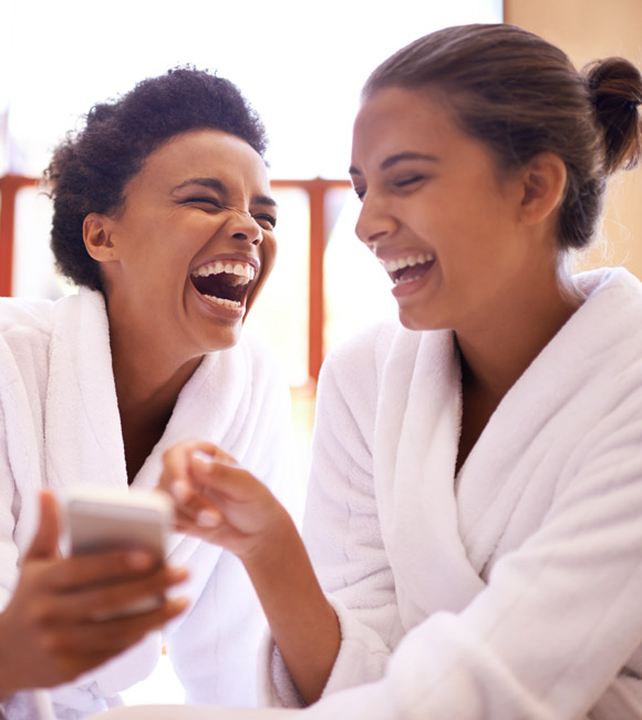 two girls laughing together
